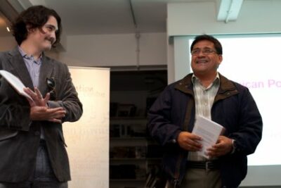 V&iacute;ctor Ter&aacute;n's gets a well-deserved round of applause after he and his translator, David Shook, read together at the MPT launch party.